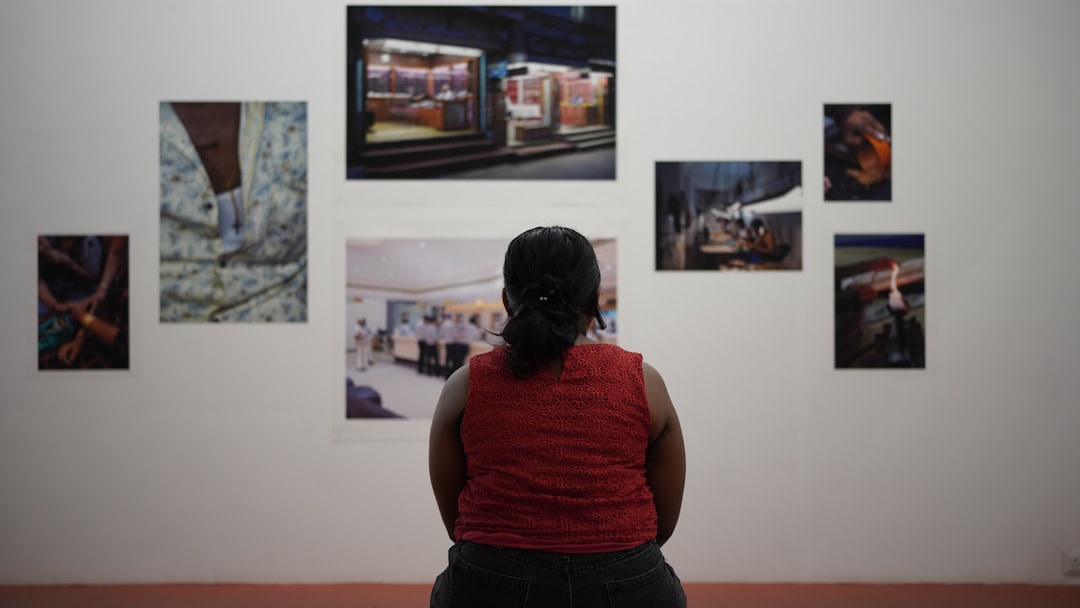 Cultural event visual reference — exhibition space with engaged visitors