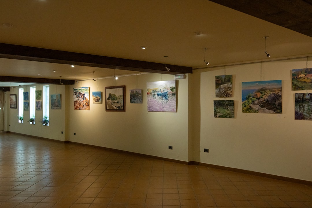 Exhibition visual reference — gallery corridor with warm lighting